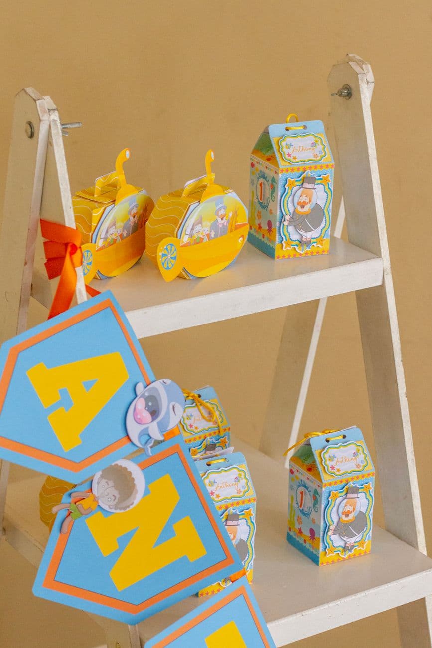 Vibrant birthday decor featuring whimsical toys and playful banners.