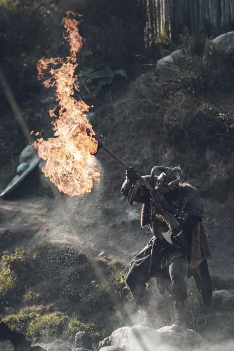 Viking warrior creating large flame with fire shooting weapon outdoors. PNG