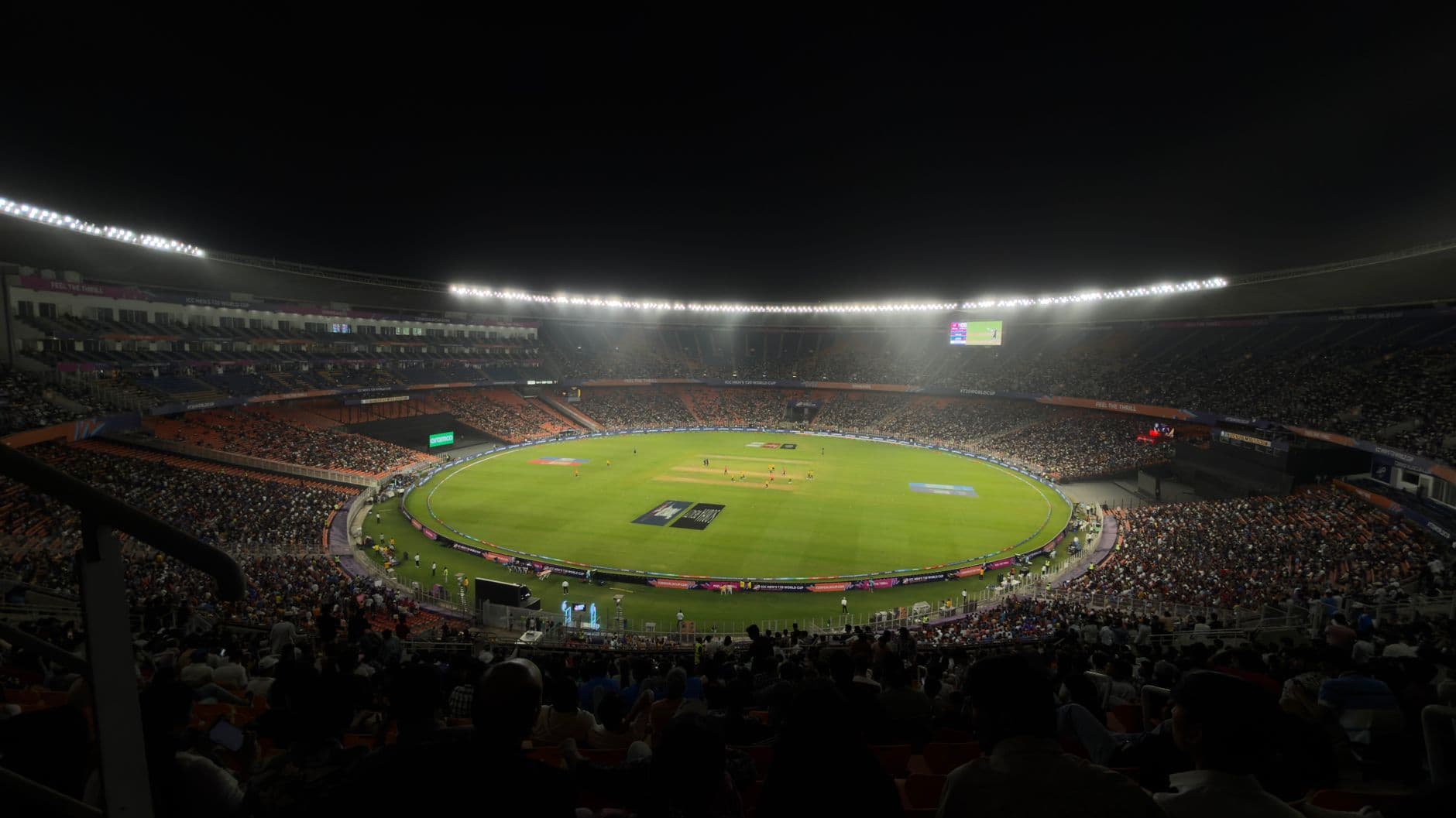 A captivating night cricket match with a large crowd at Narendra Modi Stadium in Ahmedabad
