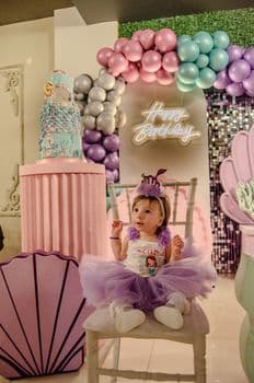A cute baby celebrates a pastel-themed birthday in Balıkesir, Türkiye. PNG