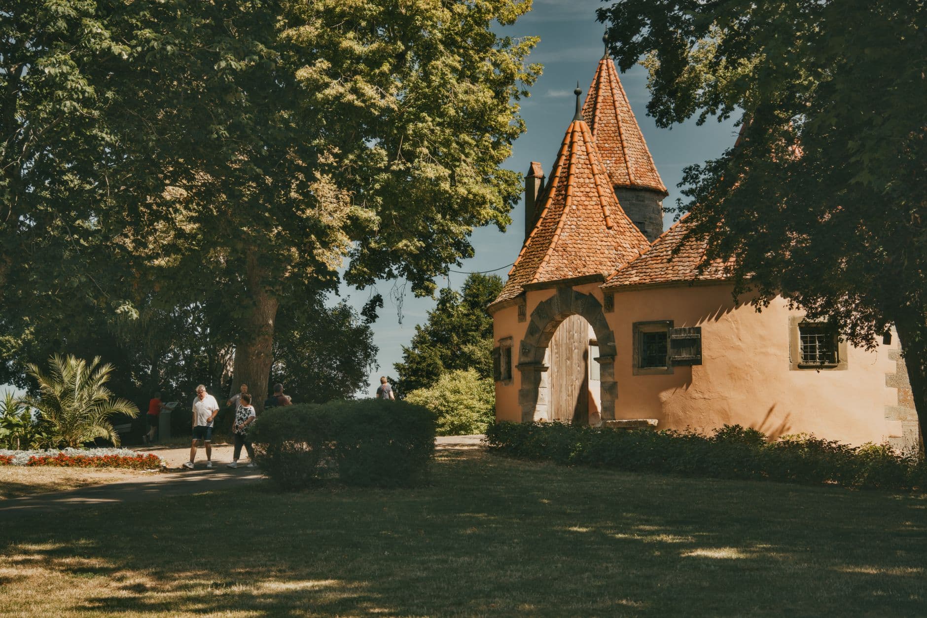 A picturesque view of a historic German old town with visitors enjoying a summer day.