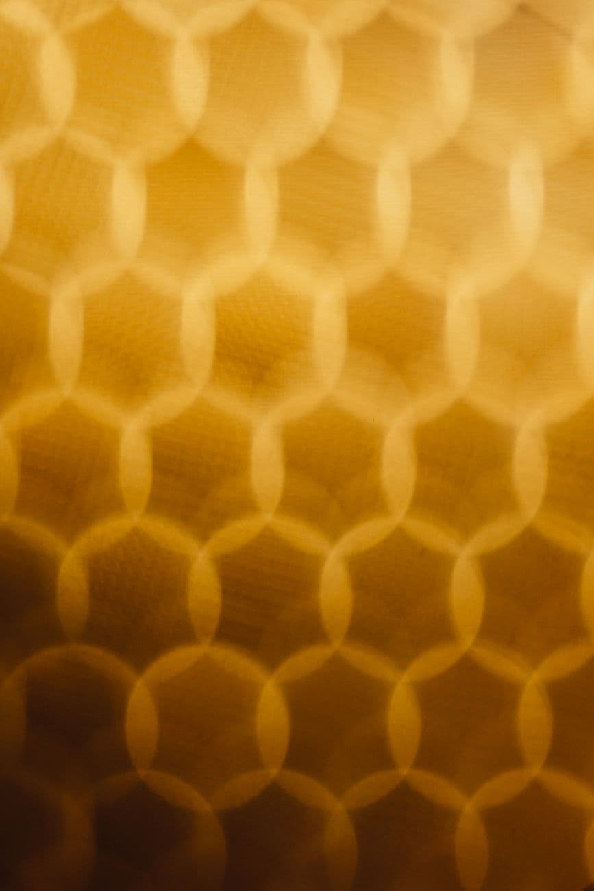 Abstract warm golden pattern with bokeh effect and geometric shapes, perfect for backgroun