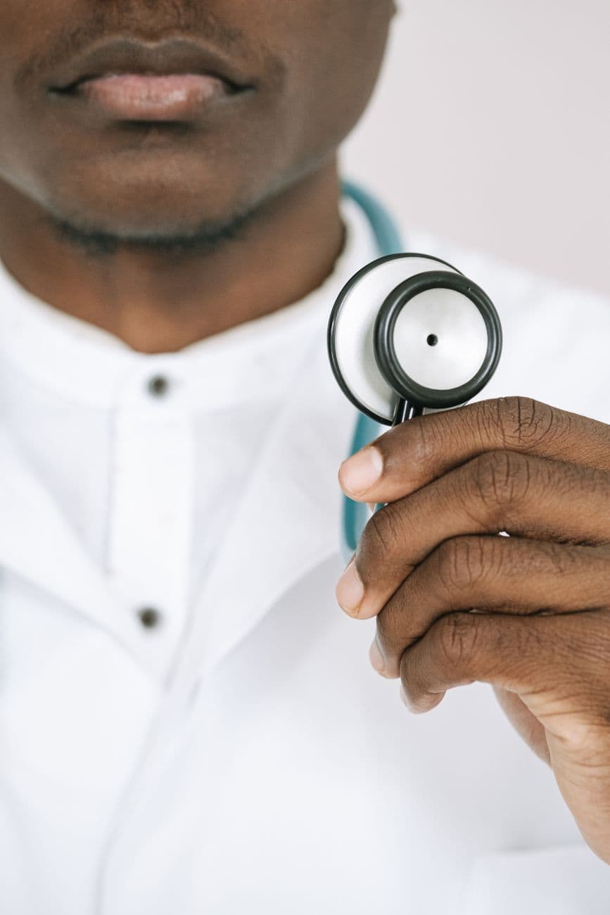 Doctor holding a stethoscope in close-up, showcasing healthcare professionalism.