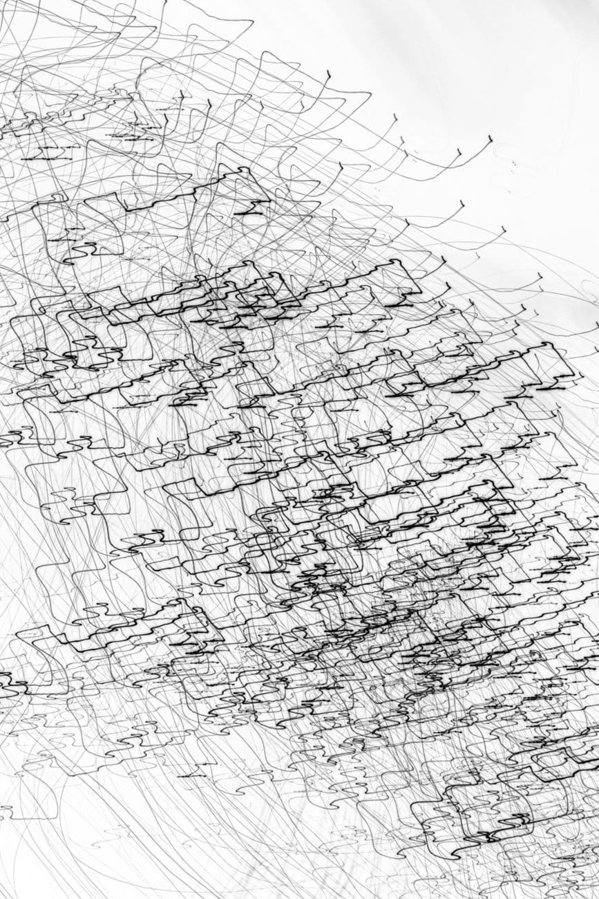 Dynamic abstract line art featuring complex patterns on a white backdrop, ideal for modern