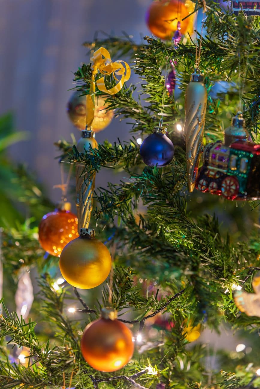 Festive Christmas tree adorned with colorful ornaments and twinkling lights, capturing hol